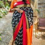Black color ikkat silk with weave design saree